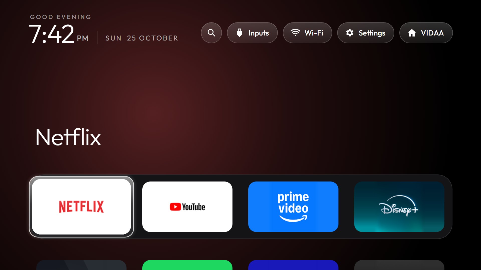 After: the new home screen, with Netflix, YouTube, Prime Video and Disney+ in a dock under the clock